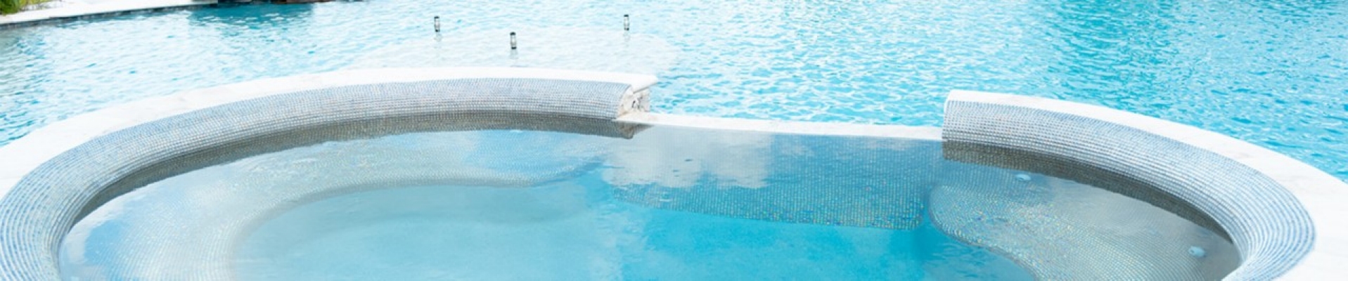 A large pool with clear blue water.